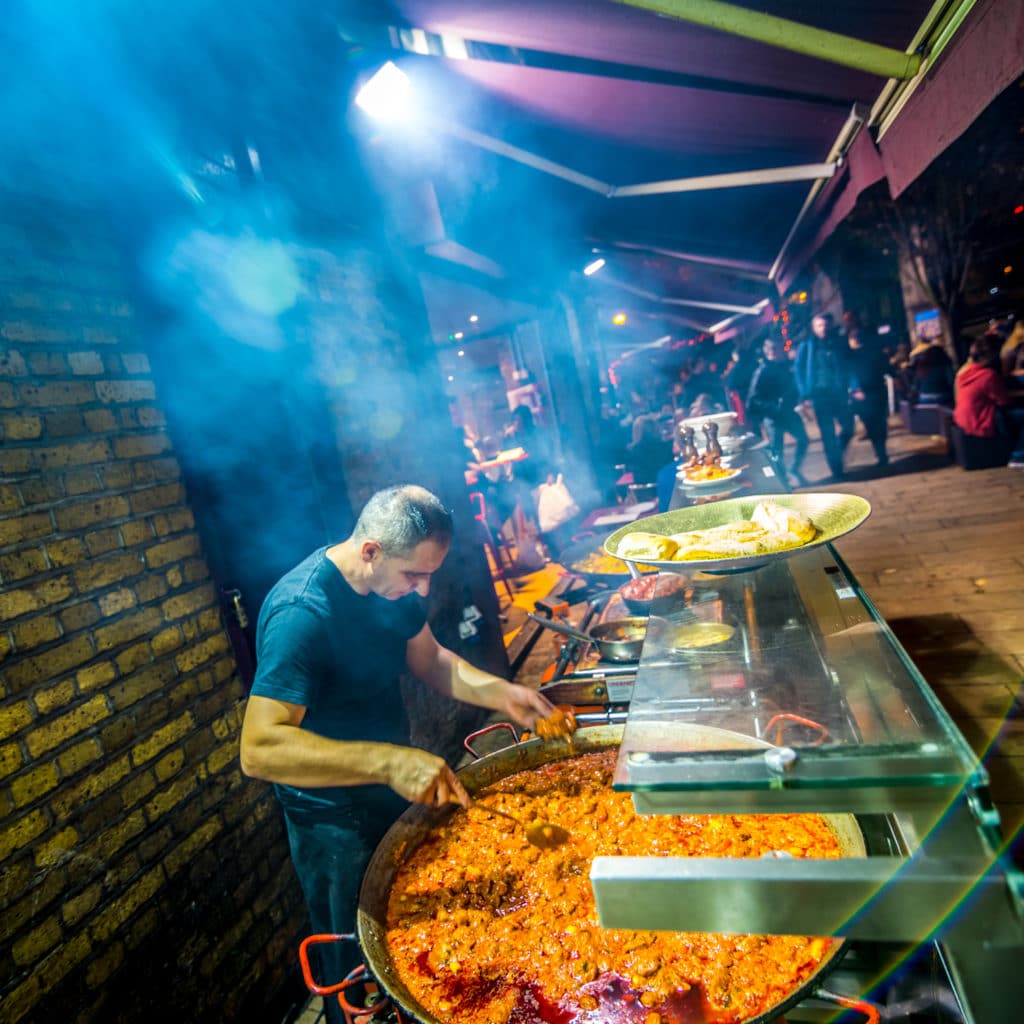 Street vendor preparing food at night in London