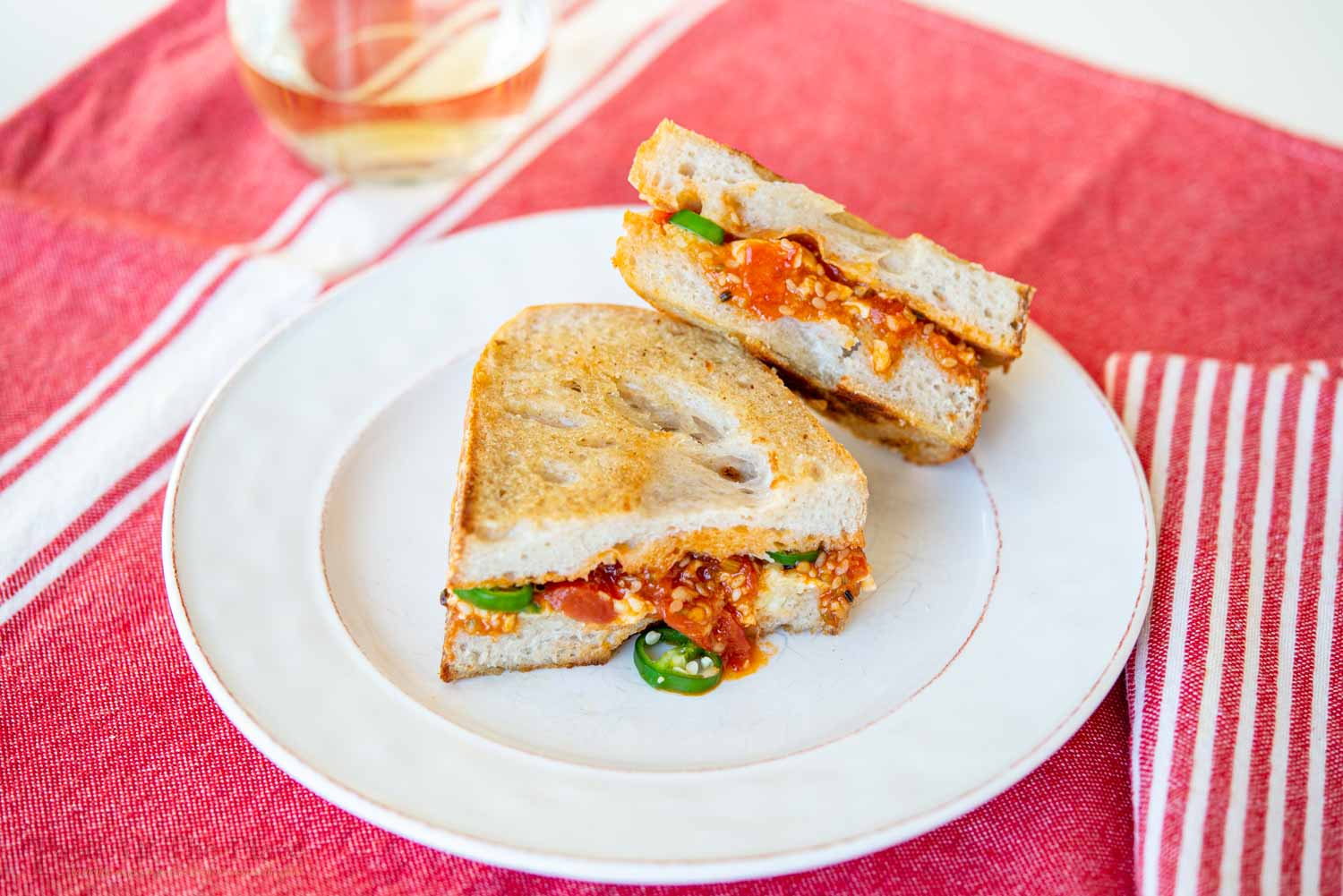 Grilled white cheddar sandwich with jalapenos and tomato chutney