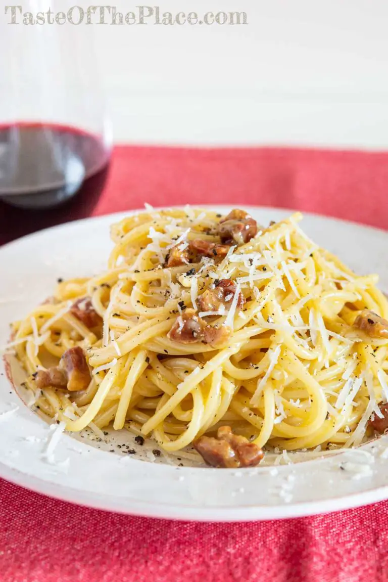 Traditional Pasta Carbonara with wine in background